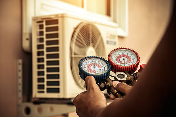 Professional Air Conditioning Service technician working in Johnson City, NY